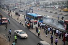 People queue as they wait for a commercial bus during the morning rush hour in Ojota district in Nigeria's commercial capital Lagos, November 23, 2015. PHOTO BY REUTERS/Akintunde Akinleye