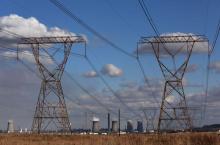 Electricity pylons are seen near cooling towers of South African petrochemical company Sasol's synthetic fuel plant in Secunda, north of Johannesburg, South Africa, May 20, 2018. PHOTO BY REUTERS/Siphiwe Sibeko