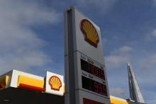 The UK £ sterling price per litre of different blends of refined petrol is seen at a Shell fuel station, with the Shard skyscraper seen behind, in central London, Britain, January 25, 2016. PHOTO BY REUTERS/Toby Melville