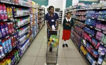 Zimbabweans shop in a supermarket in the capital Harare. PHOTO BY REUTERS/Philimon Bulawayo