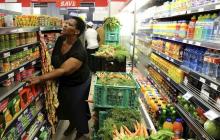 A shopper looks for items at an informal shop piloted by Pick n Pay in Soweto, South Africa, February 25, 2016. PHOTO BY REUTERS/Siphiwe Sibeko
