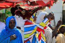 A woman uses a mobile phone to make photographs after attending prayers marking the Eid al-Adha celebration at an open field in Kofar Mata district in Nigeria's northern city of Kano, September 1, 2017. PHOTO BY REUTERS/Akintunde Akinleye