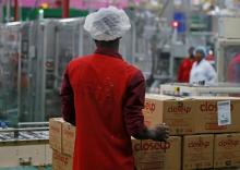 A worker stacks the boxes of toothpaste produced at the Unilever factory in Lagos, Nigeria, January 18, 2018. PHOTO BY REUTERS/Afolabi Sotunde