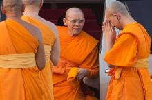 Abbot Phra Dhammachayo (C) arrives for a ceremony at the Wat Phra Dhammakaya temple in Pathum Thani province, north of Bangkok on Makha Bucha Day, March 4, 2015. PHOTO BY REUTERS/Damir Sagolj