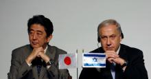 Japan's Prime Minister Shinzo Abe (L) and his Israeli counterpart Benjamin Netanyahu sit together during their joint statements in Jerusalem, January 18, 2015. PHOTO BY REUTERS/Baz Ratner