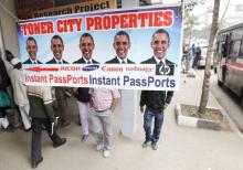 Residents walk past a commercial poster with the portrait photo of the U.S. President Barack Obama ahead of his scheduled State visit in Kenya's capital Nairobi, July 23, 2015. PHOTO BY REUTERS/Thomas Mukoya