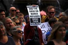 Refugee advocates hold placards as they participate in a protest in Sydney, Australia, against the treatment of asylum-seekers at Australia-run detention centres located at Nauru and Manus Island, November 18, 2017. PHOTO BY REUTERS/David Gray
