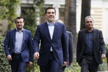 Greece's newly-appointed Prime Minister Alexis Tsipras (C) leaves the Presidential Mansion after his swearing-in ceremony as Greece's first leftist prime minister in Athens, January 26, 2015. PHOTO BY REUTERS/Marko Djurica
