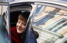 German Chancellor Angela Merkel leaves after a meeting with U.S. Vice President Joe Biden and Ukraine's President Petro Poroshenko (not pictured) during the 51st Munich Security Conference at the 'Bayerischer Hof' hotel in Munich, February 7, 2015. PHOTO BY REUTERS/Michaela Rehle