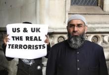 Demonstrator Anjem Choudary, protests in support of Islamist cleric Abu Hamza al-Masri, who is appealing against his extradition to the U.S., outside the High Court in London, October 5, 2012. PHOTO BY REUTERS/Luke MacGregor
