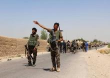 An Afghan National Army (ANA) soldier gestures as they arrive in Nad Ali district of Helmand province, southern Afghanistan, August 10, 2016. PHOTO BY REUTERS/Abdul Malik