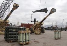 Workers unload artillery, part of a military donation from the U.S. government to the Lebanese army, during a ceremony at Beirut's port, February 8, 2015. PHOTO BY REUTERS/Mohamed Azakir