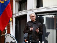 WikiLeaks founder Julian Assange speaks on the balcony of the Embassy of Ecuador in London, Britain, May 19, 2017. PHOTO BY REUTERS/Neil Hall