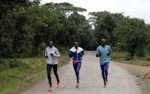 Athletes from South Sudan, part of the refugee athletes qualified for the 2016 Rio Olympics, (L-R) Paulo Amotun Lokoro of 1500m, Rose Nathike Lokonyen of 800m, Yiech Pur Biel of 800m, run along a dusty road during a training session at their camp in Ngong township near Kenya's capital Nairobi, June 9, 2016. PHOTO BY REUTERS/Thomas Mukoya