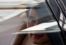 Myanmar's State Counsellor Aung San Suu Kyi sits in her car after arriving at the airport in New Delhi, October 17, 2016. PHOTO BY REUTERS/Adnan Abidi