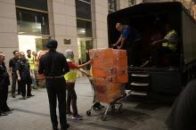 A Malaysian police officer pushes a trolley during a raid of three apartments in a condominum owned by former Malaysian prime minister Najib Razak’s family, in Kuala Lumpur, May 17, 2018, in this photo taken by The Straits Times. PHOTO BY REUTERS/Ariffin Jamar/The Straits Times 