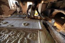 A baker prepares bread in Khartoum December 31, 2010. Prices are rising in Sudan ahead of the January 9 referendum on independence for the oil-producing south of Sudan which most believe will result in secession. PHOTO BY REUTERS/Mohamed Nureldin Abdallah