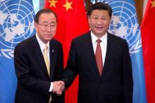 U.N. Secretary General Ban Ki-moon (L) and Chinese President Xi Jinping shake hands as they pose for a photo at the Diaoyutai State Guesthouse in Beijing, China, July 7, 2016. PHOTO BY REUTERS/Mark Schiefelbein
