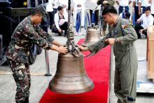 Philippine Air Force personnel unload the bells of Balangiga after their arrival at Villamor Air Base in Pasay, Metro Manila, Philippines, December 11, 2018. PHOTO BY REUTERS/Erik De Castro