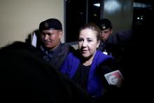 Guatemalan Supreme Court judge Blanca Stalling is escorted by policemen after being arrested on influence trafficking, at the Supreme Court of Justice in Guatemala City, Guatemala, February 8, 2017. PHOTO BY  REUTERS/Luis Echeverria