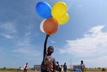 A Rohingya child plays with balloons at a temporary shelter in Kuala Cangkoi, Lhoksukon, Aceh province, Indonesia, June 2, 2015. MPHOTO BY REUTERS/Zabur Karuru