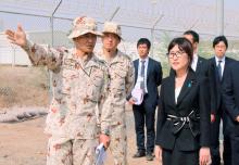 Japan's Defence Minister Tomomi Inada (front, R) is briefed by senior Self-Defense Forces personnel about their anti-piracy mission off Somalia, in Djibouti, August 15, 2016. PHOTO BY REUTERS