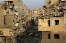 A view shows damaged buildings in Deir al-Zor, eastern Syria, February 19, 2014. PHOTO BY REUTERS/Khalil Ashawi