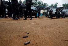 Bullet casings are seen on the ground as policemen stand at the National Police Academy in the Cocody neighborhood in Abidjan, Ivory Coast, July 20, 2017. PHOTO BY REUTERS/Luc Gnago