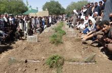 Afghans take part in a burial ceremony for the victims of a suicide bombing attack that took place in a Shi'ite mosque in Gardez, Paktia province, Afghanistan, August 4, 2018. PHOTO BY REUTERS/Stringer