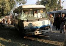 People look at a damaged bus after a suicide attack in Jalalabad city, Afghanistan, November 23, 2017. PHOTO BY REUTERS/Parwiz