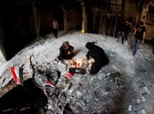 Iraqi women light candles during Eid al-Fitr as they mark the end of the fasting month of Ramadan, at the site of a suicide car bomb attack over the weekend at the shopping area of Karrada, in Baghdad, Iraq, July 6, 2016. PHOTO BY REUTERS/Thaier Al-Sudani