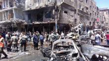 Men and Syrian Army members inspect a damaged site after a suicide and car bomb attack in south Damascus Shi'ite suburb of Sayeda Zeinab, Syria in this handout picture provided by SANA, June 11, 2016. PHOTO BY REUTERS/SANA