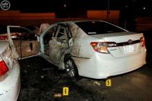 A car is damaged after a blast near the U.S. consulate in Saudi Arabia's second city of Jeddah, July 4, 2016. PHOTO BY REUTERS/Saudi Press Agency