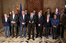 Catalan Regional President Carles Puigdemont (C) is flanked by members of his government as he makes an statement at Generalitat Palace in Barcelona, Spain, October 1, 2017. PHOTO BY REUTERS/Catalan Goverment/Jordi Bedmar Pascual