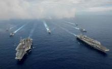 The Nimitz-class aircraft carriers USS John C. Stennis (CVN 74), and USS Ronald Reagan (CVN 76) (R) conduct dual aircraft carrier strike group operations in the U.S. 7th Fleet area of operations in support of security and stability in the Indo-Asia-Pacific in the Philippine Sea, June 18, 2016. PHOTO BY REUTERS/Jake Greenberg