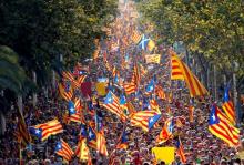 People hold Catalan separatist flags known as "Esteladas" during a gathering to mark the Calatalonia day "Diada" in central Barcelona, Spain, September 11, 2014. PHOTO BY REUTERS/Albert Gea