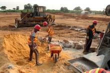 Labourers mix cement at the site of a new port to be built in the oil-producing Angolan exclave of Cabinda, June 11, 2016. PHOTO BY REUTERS/Ed Cropley