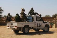 Chadian U.N. peacekeepers gesture as they patrol during a ceremony marking two years since Malian soldiers were killed in a massacre by radical Islamists, in Aguelhok, Mali January 24, 2014. PHOTO BY REUTERS/Stringer