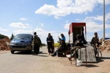 Members of al Qaeda's Nusra Front man a checkpoint at the entrance of Idlib city, April 14, 2015. PHOTO BY REUTERS/Mohamad Bayoush