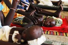 Malnourished children lay next to their mothers at the Medecins Sans Frontieres (MSF) hospital in Leer, July 15, 2014. PHOTO BY REUTERS/Andreea Campeanu