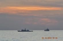 A handout photo shows two Chinese surveillance ships which sailed between a Philippines warship and eight Chinese fishing boats to prevent the arrest of any fishermen in the Scarborough Shoal, a small group of rocky formations