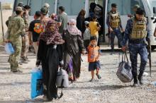 Civilians who fled their homes due to clashes gather at Camp Tariq, south of Falluja, Iraq, June 4, 2016. PHOTO BY REUTERS/Thaier Al-Sudani