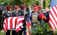 An honor guard carries the coffin of U.S. Army Sergeant La David Johnson, who was among four special forces soldiers killed in Niger, at a graveside service in Hollywood, Florida, October 21, 2017. REUTERS/Joe Skipper