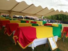 Coffins are draped in Malian flags at a funeral for 17 soldiers who were killed earlier this week in Segou, Mali, July 21, 2016. PHOTO BY REUTERS/Mamadou Camara