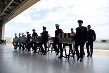 Honor guards carry caskets containing the remains of American servicemen from the Korean War handed over by North Korea upon arrival at Joint Base Pearl Harbor-Hickam in Honolulu, Hawaii, U.S., August 1, 2018. PHOTO BY REUTERS/Hugh Gentry