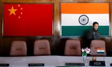  man walks inside a conference room used for meetings between military commanders of China and India, at the Indian side of the Indo-China border at Bumla, in the northeastern Indian state of Arunachal Pradesh, November 11, 2009. PHOTO BY REUTERS/Adnan Abidi