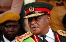 Retired Commander of Zimbabwe Defence Forces (ZDF) General Constatino Chiwenga looks on after the swearing in of Emmerson Mnangagwa as Zimbabwe's new president in Harare, Zimbabwe, November 24, 2017. PHOTO BY REUTERS/Siphiwe Sibeko