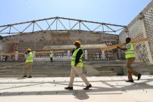 Construction workers carry wooden beams as they take part in the renovation project of Somalia's National Theatre in Mogadishu, Somalia, February 3, 2019. PHOTO BY REUTERS/Feisal Omar