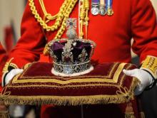 The Imperial State Crown is carried in for Britain's Queen Elizabeth during the annual State Opening of Parliament in London, November 18, 2009. PHOTO BY REUTERS/Toby Melville