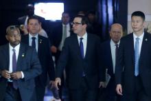 Members of U.S. trade delegation, Treasury Secretary Steven Mnuchin and Commerce Secretary Wilbur Ross, leave a hotel in Beijing, China, May 4, 2018. PHOTO BY REUTERS/Thomas Peter